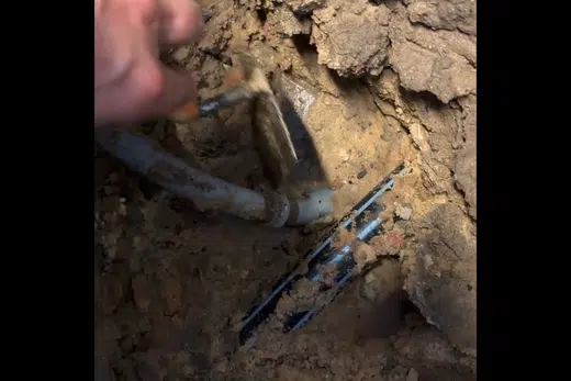 Excavated pipe repair area with exposed underground plumbing related to Sewer Line Repair in Monrovia